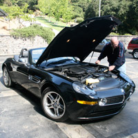 Man applying Fluid Film in a car